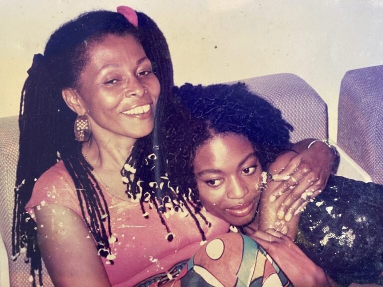 Assata Shakur, smiling, with a friend
